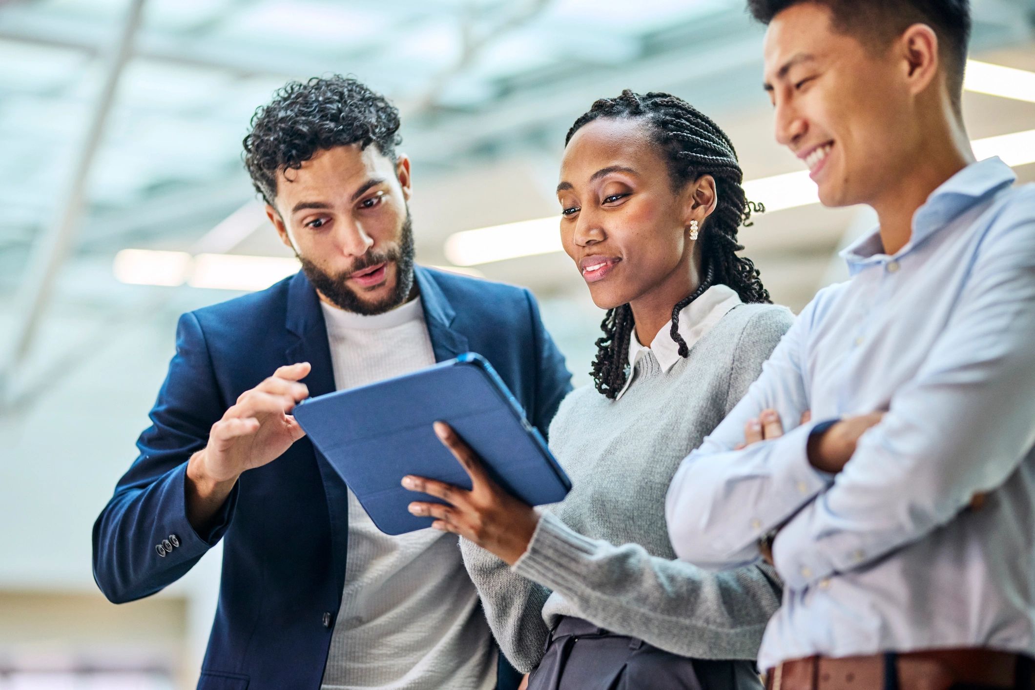 Technology consulting team reviewing data together in an office